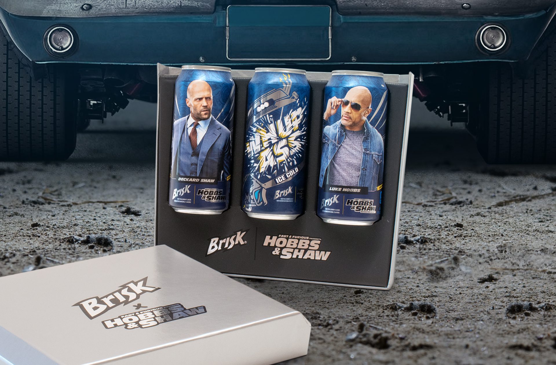 Photograph of three cans of Brisk with custom limited-edition packaging inside an influencer unboxing experience for the Hobbs and Shaw premiere collaboration with Brisk.