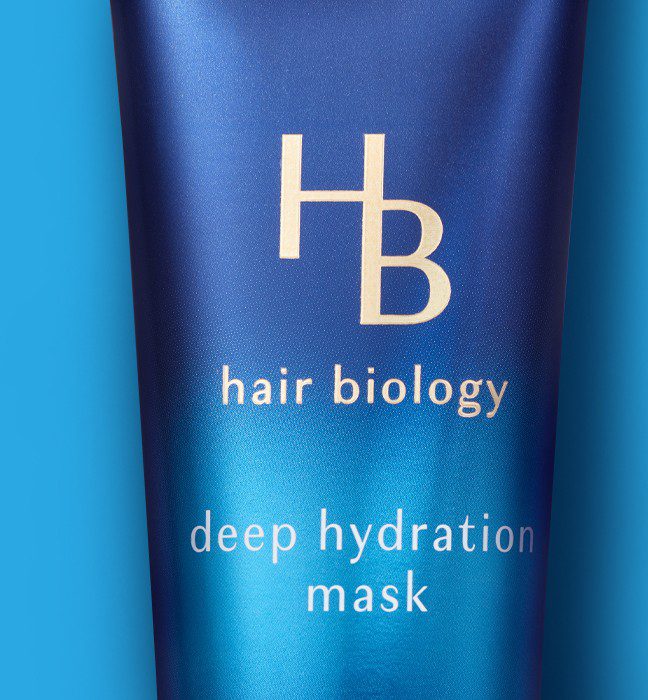 Close up photograph of a Hair Biology hair care product, showcasing cpg packaging and logo design services.