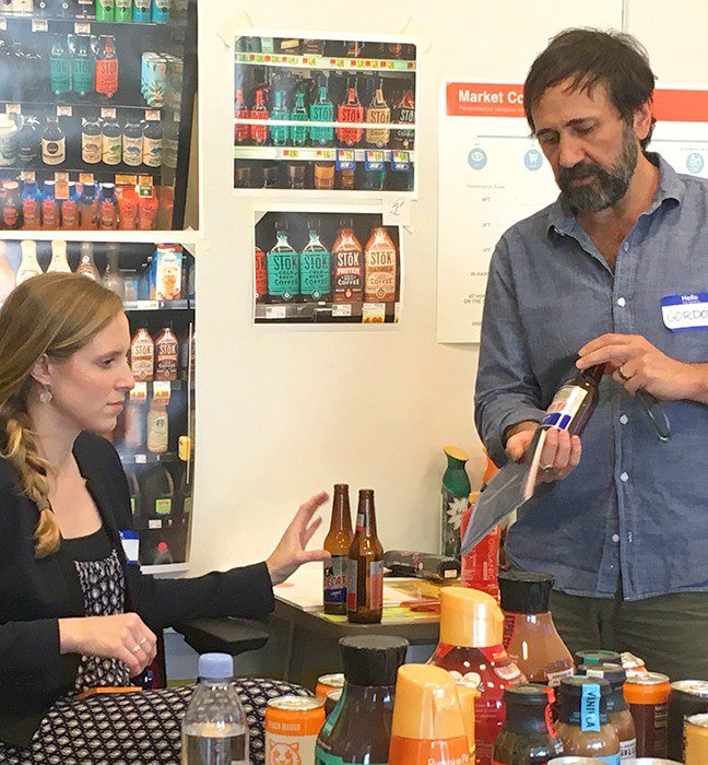 Photograph of a brand design workshop between the Danone team and a product packaging design agency, working together to develop seasonal variant for international delight coffee creamer.