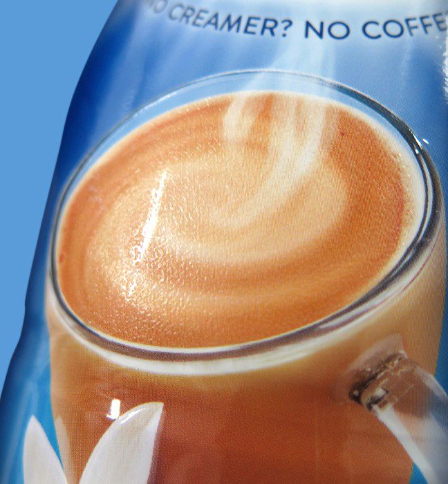 Close up photograph of a seasonal variant for international delight coffee creamer, showcasing print effect services for consumer packaged goods.