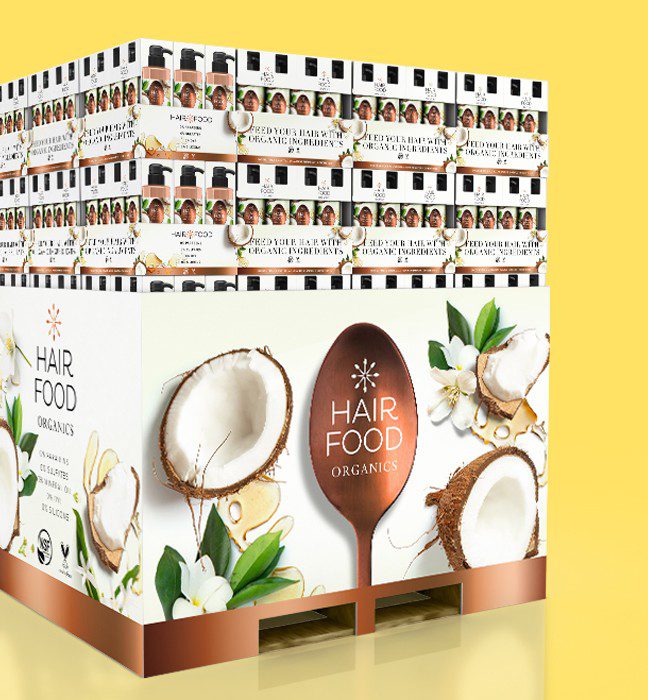 Render of a retail in store display for Hair food organics products hair care products, showcasing brand world and identity design services for consumer packaged goods.