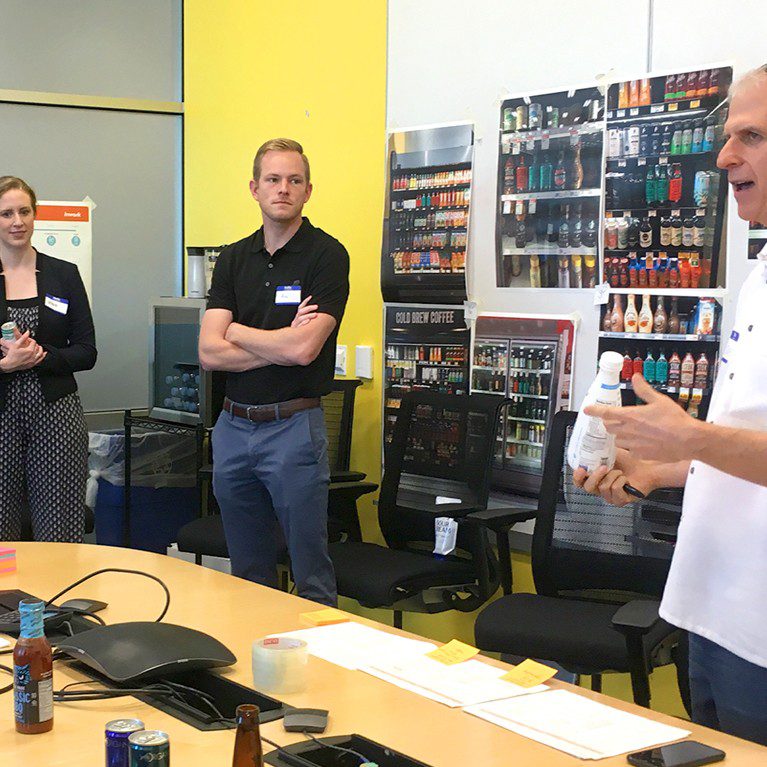 Photograph of a branding workshop between the Danone team and a product packaging design agency, working together to develop seasonal variant for international delight coffee creamer.