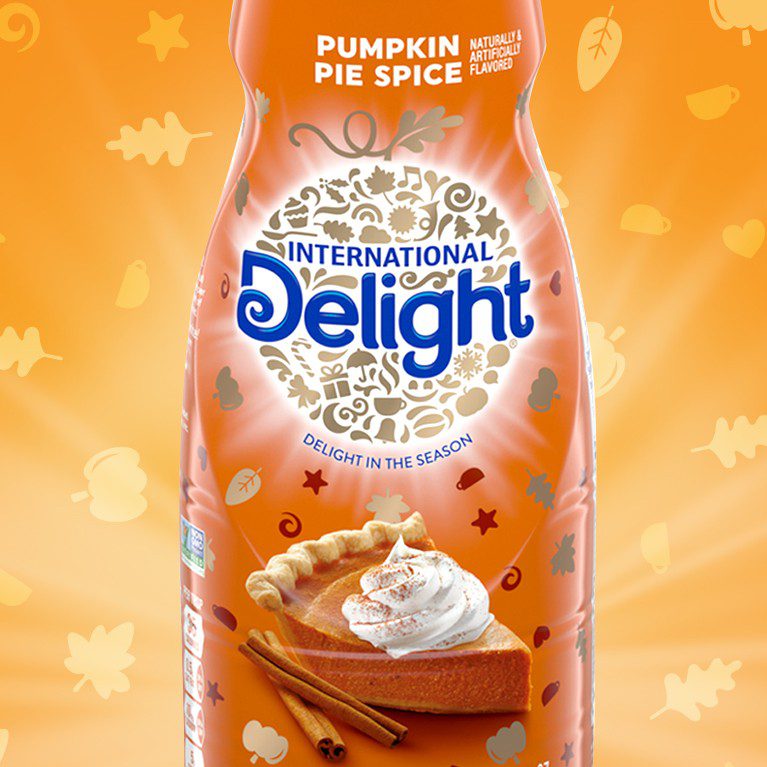 Product photography of a pumpkin spice seasonal variant for international delight coffee creamer, showcasing brand identity design services for consumer packaged goods.