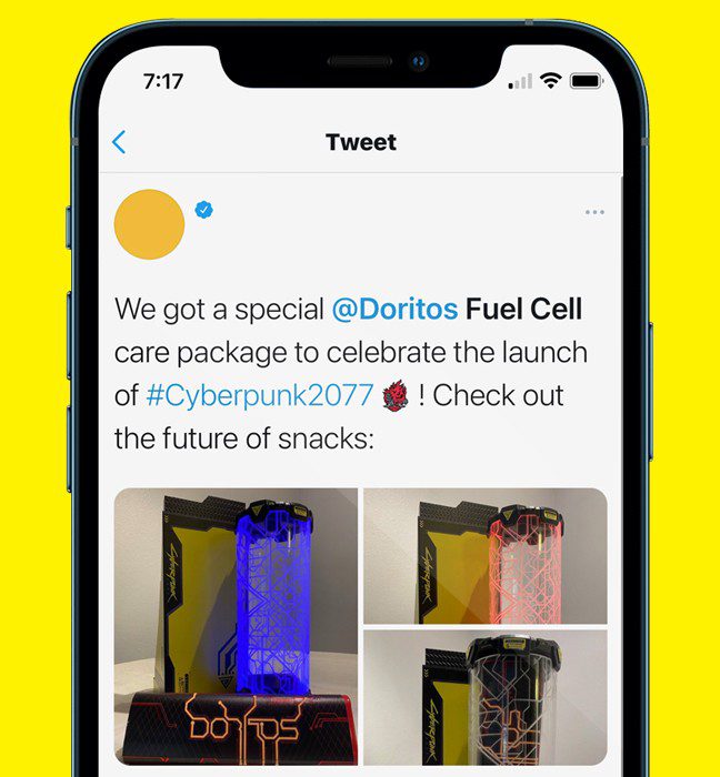 Photograph of a tweet showcasing a fuel cell themed influencer unboxing experience promoting Cyberpunk 2077 and Doritos.