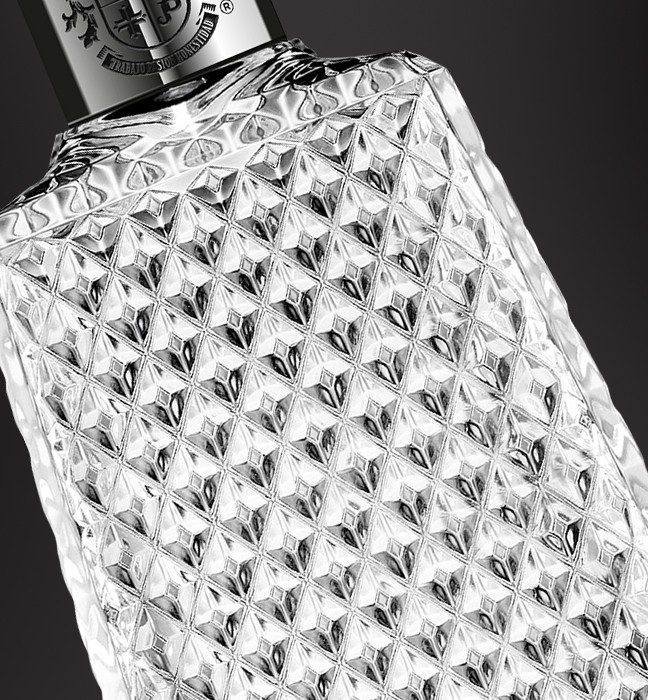 Close up photograph of a Proximo Spirits 1800 Cristalino Tequila bottle, showcasing production feasible packaging created by a by a product packaging printing and design agency.