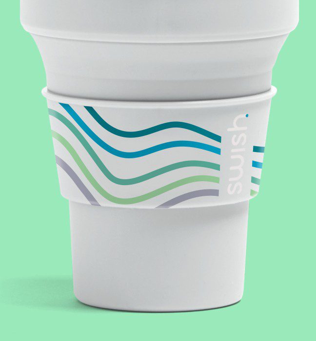 Photograph of the retractable cup included in an unboxing experience promoting the launch of Swish Colgate Mouthwash for quick sampling of the new product.