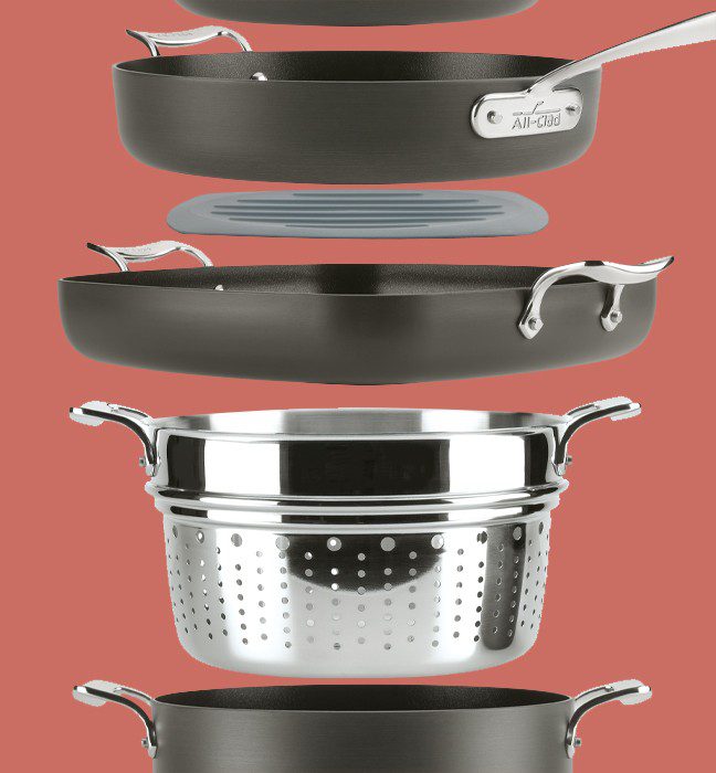 Product photography of All-clad metalcrafters essential nonstick cookware stacked.