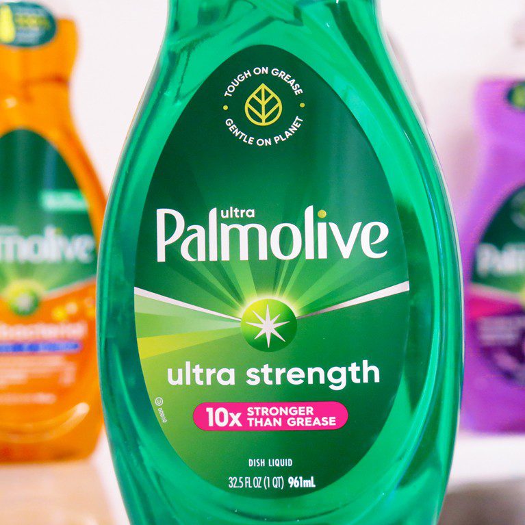 Close up photograph of a bottle of ultra strength palmolive dish soap, featuring a cold foil print technique used to create sales samples by a product packaging printing agency.