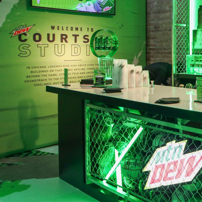 Photograph of a branded set-up for the influencer unboxing experience for the Mountain Dew Basketball limited edition cans featuring NBA All-Stars.