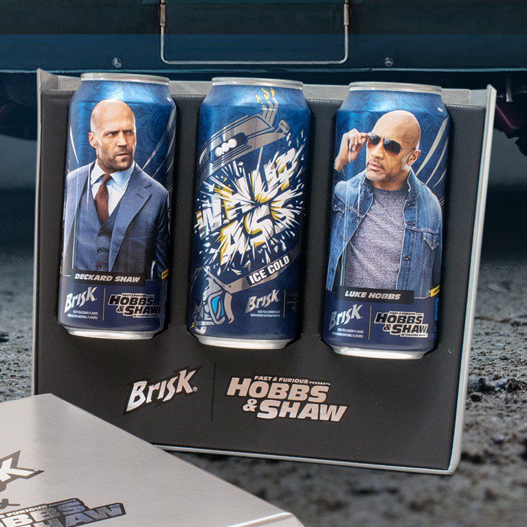 Close-up shot of three cans of Brisk with custom limited-edition packaging inside an influencer unboxing experience for the Hobbs and Shaw premiere collaboration with Brisk.