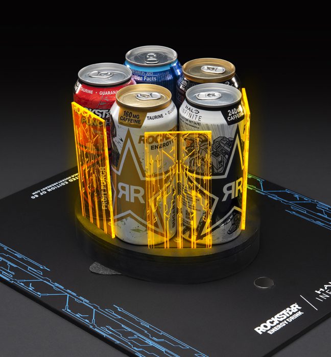 Photograph of the five cans of rockstar energy held inside a limited edition illustrated Master Chief helmet created as an influencer unboxing experience promoting Rockstar Energy and Halo Infinite.