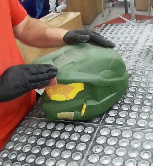 Photograph from the production process for a limited edition illustrated Master Chief helmet created as an influencer unboxing experience promoting Rockstar Energy and Halo Infinite.