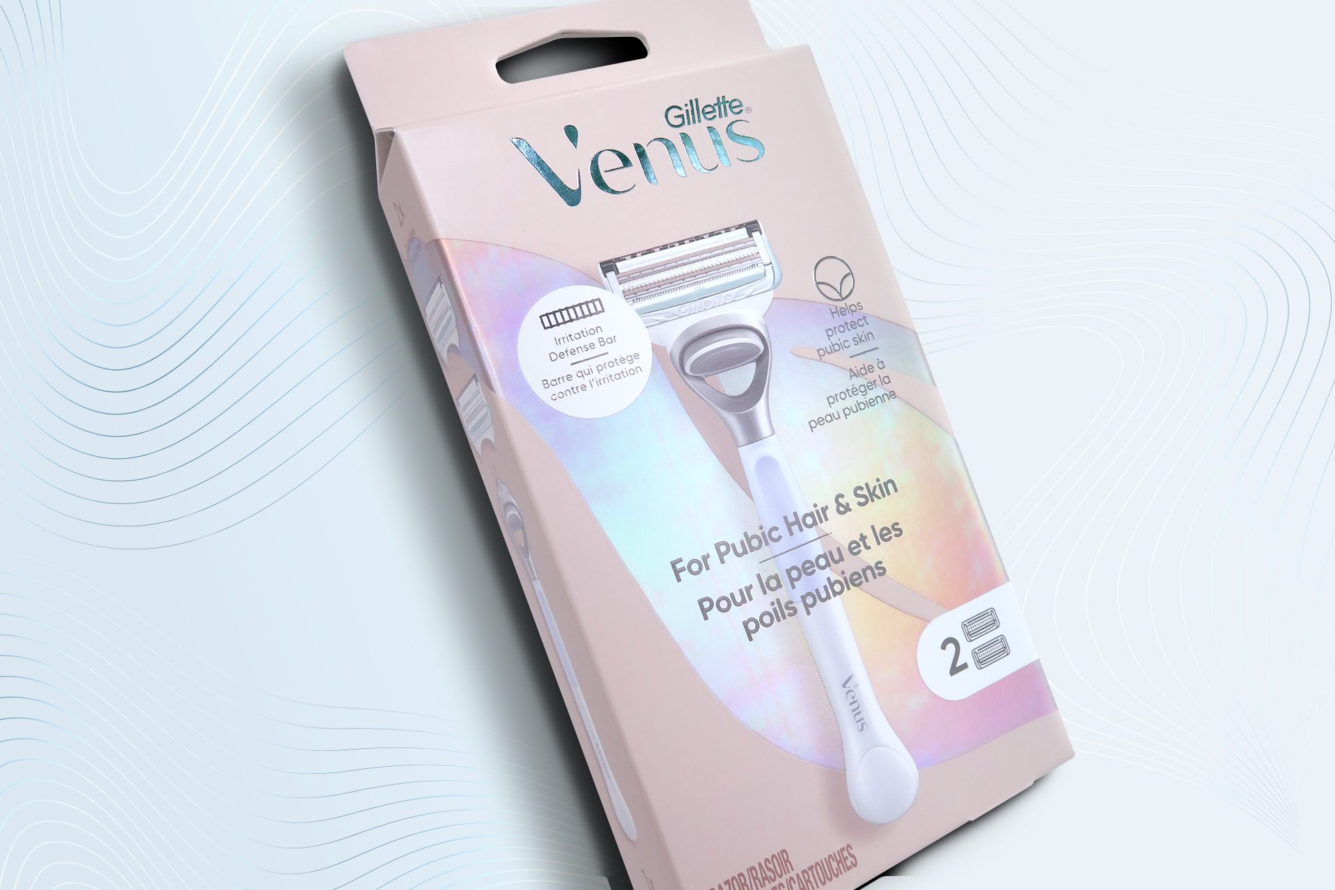 Product photography of a venus pubic hair razor, showcasing packaging design services for consumer packaged goods.