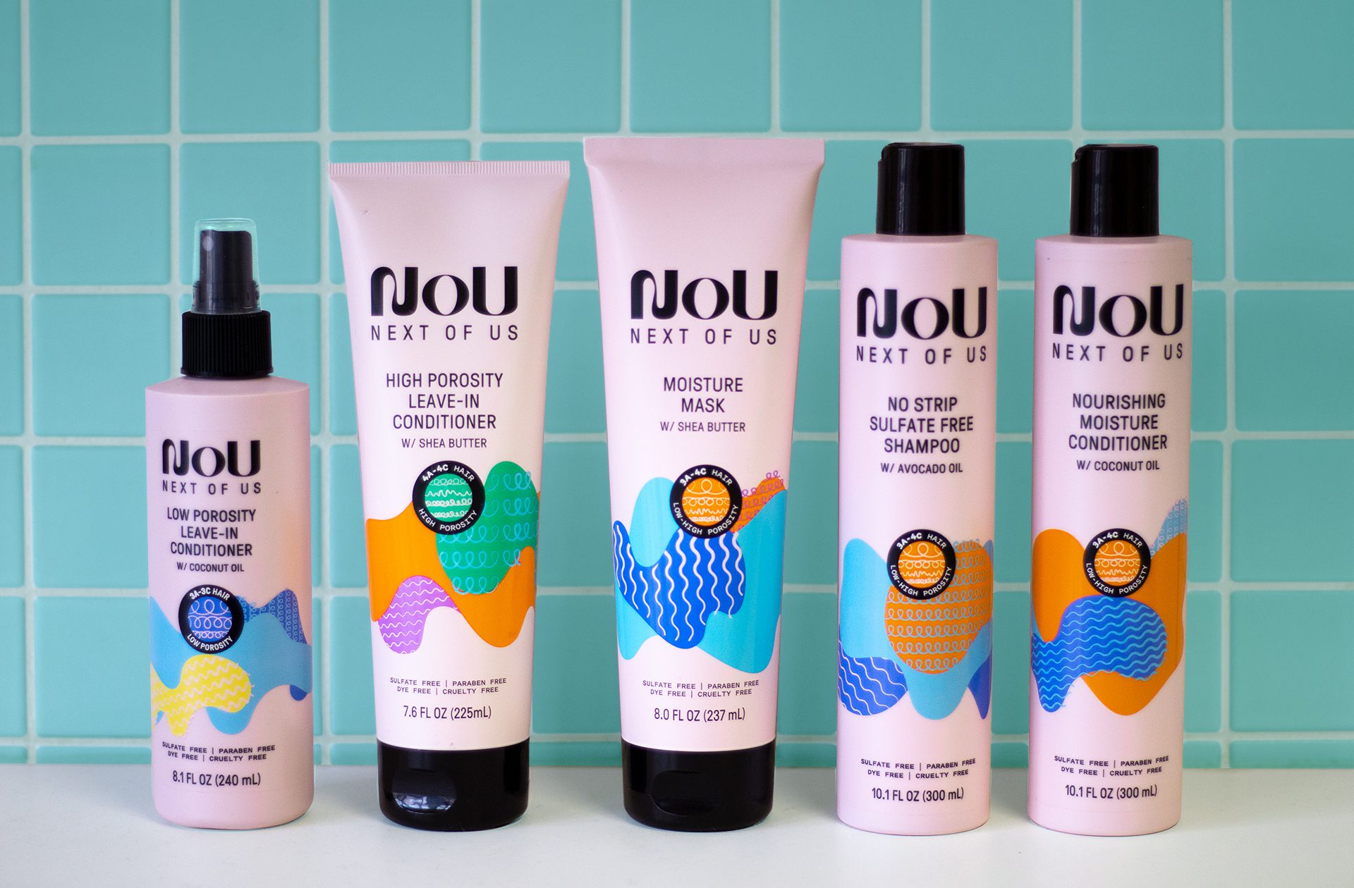 Photograph of a full line of nou hair care products, showcasing packs created by a product packaging design agency.
