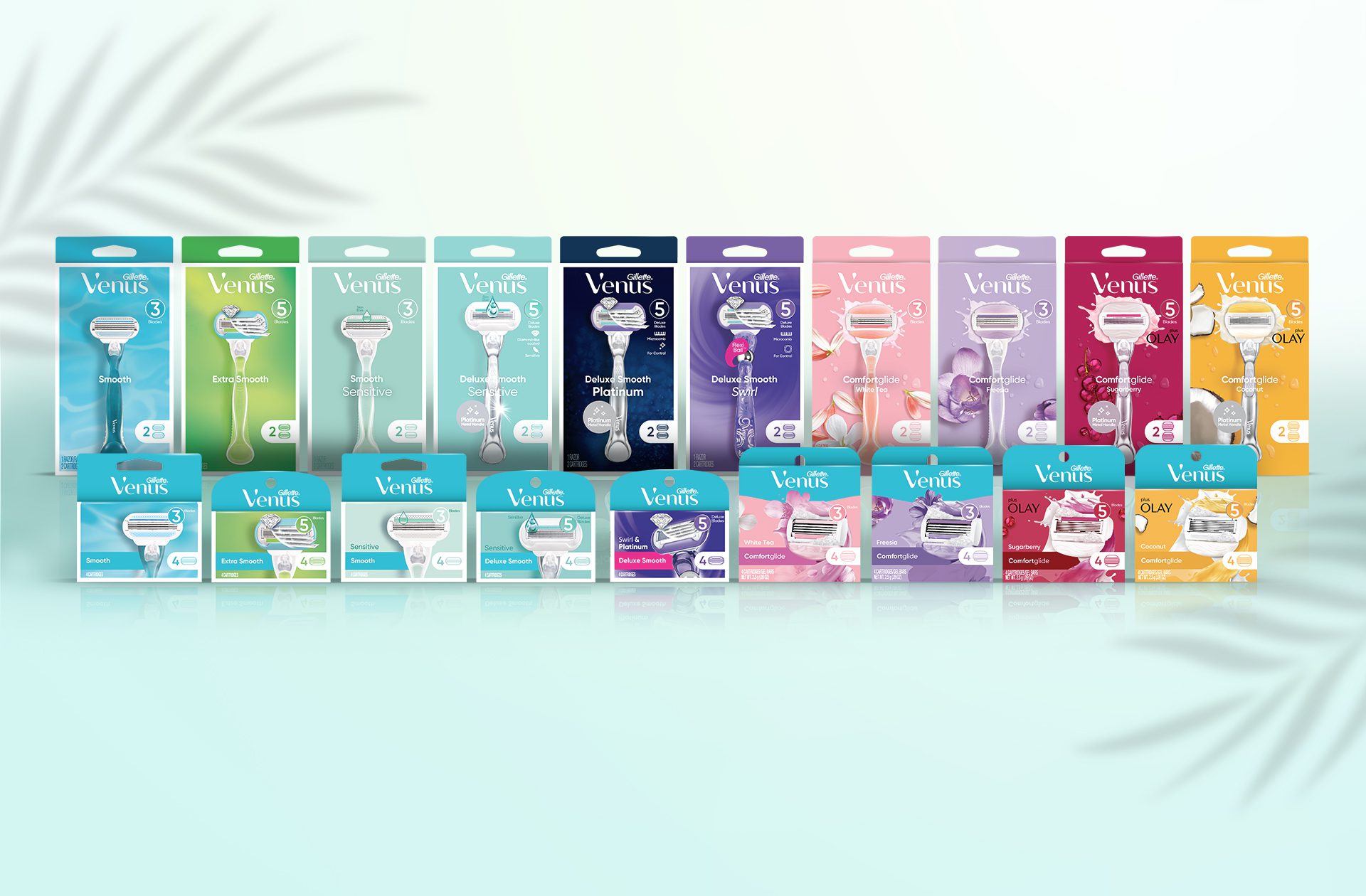 Photograph of a full product line of Gillette Venus including smooth, comfortglide and deluxe smooth razors and cartridges, featuring packs created by a cpg packaging design agency.