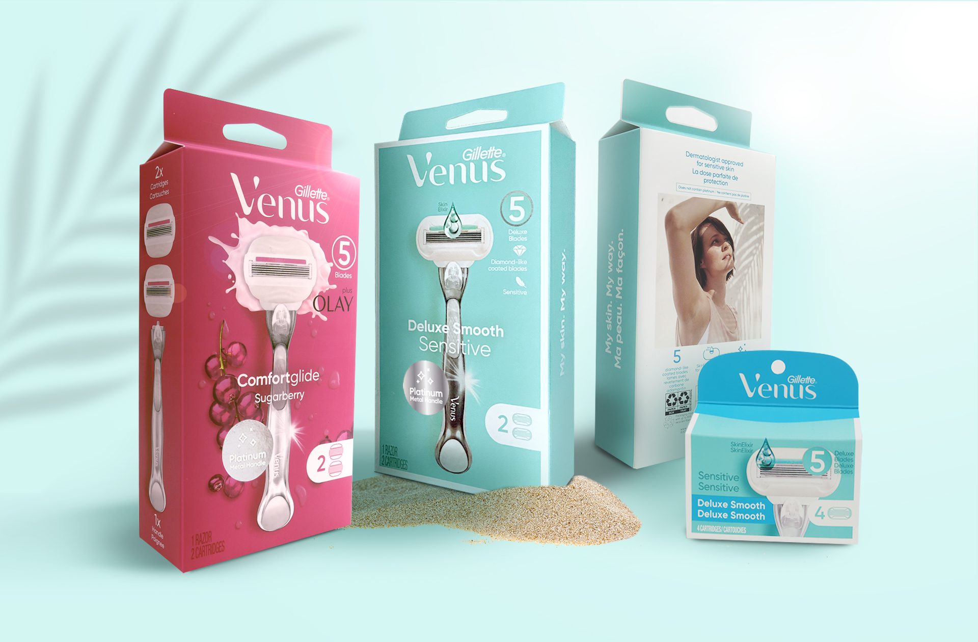 Product photography of different packs of Gillette Venus comfortglide and deluxe smooth razors, showcasing showcasing Cpg packaging design services.