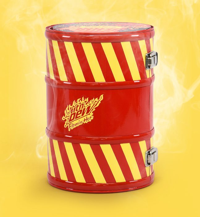 Photograph of a smoking ‘fire retardant’ case themed influencer unboxing experience kits promoting the limited edition flavor FLAMIN HOT Mountain Dew, featuring a custom headband and note.