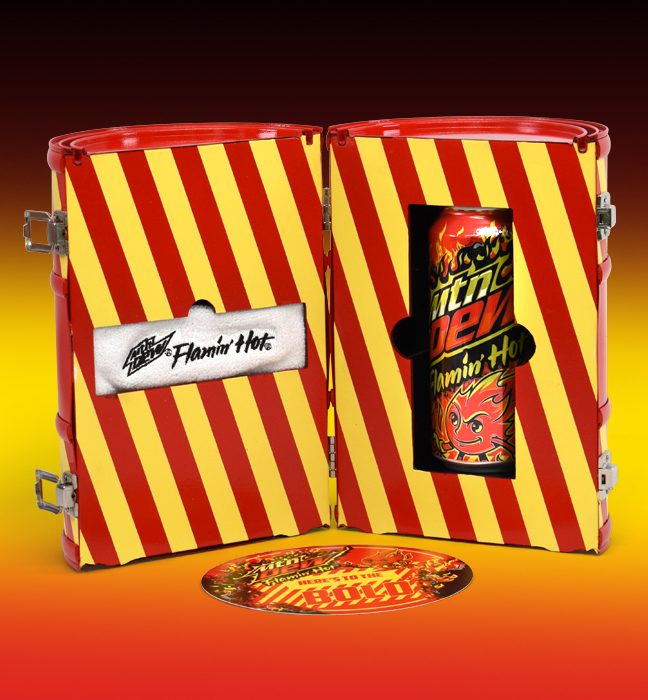 Photograph of an open ‘fire retardant’ case themed influencer unboxing experience kits promoting the limited edition flavor FLAMIN HOT Mountain Dew, featuring a custom headband and note.