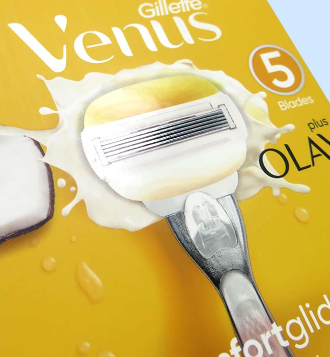 Close up photograph of a box of Gillette Venus comfortglide razors, showcasing brand identity design services for consumer packaged goods.