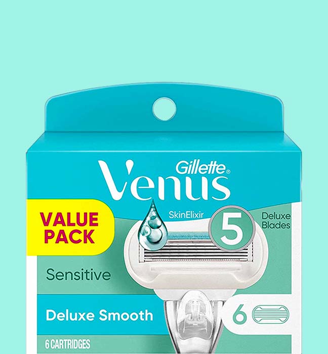 Close up photograph of a box of Gillette Venus deluxe smooth razors cartridges, created by a product packaging design agency.