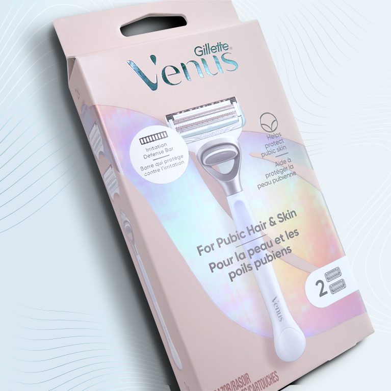 Product photography of a venus pubic hair razor, showcasing packaging design services for consumer packaged goods.