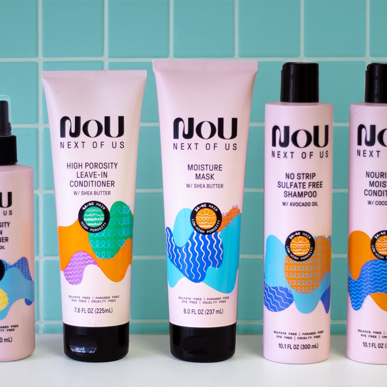 Photograph of a full line of nou hair care products, showcasing packs created by a product packaging design agency.