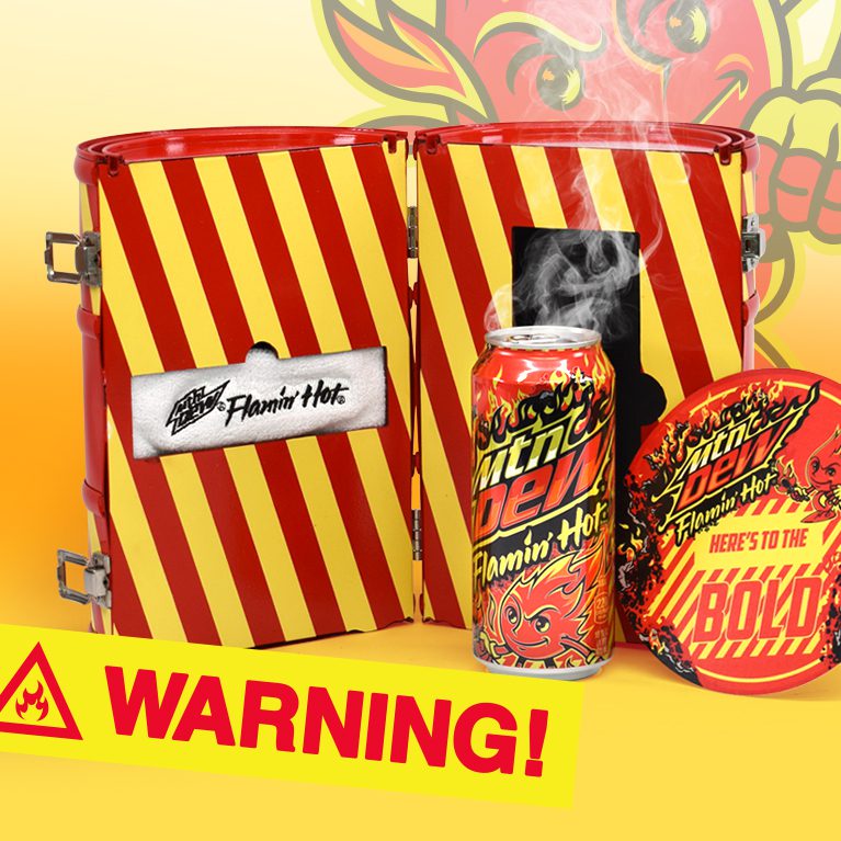Photograph of an open ‘fire retardant’ case themed influencer unboxing experience kit promoting the limited edition flavor FLAMIN HOT Mountain Dew, featuring a custom headband and note.
