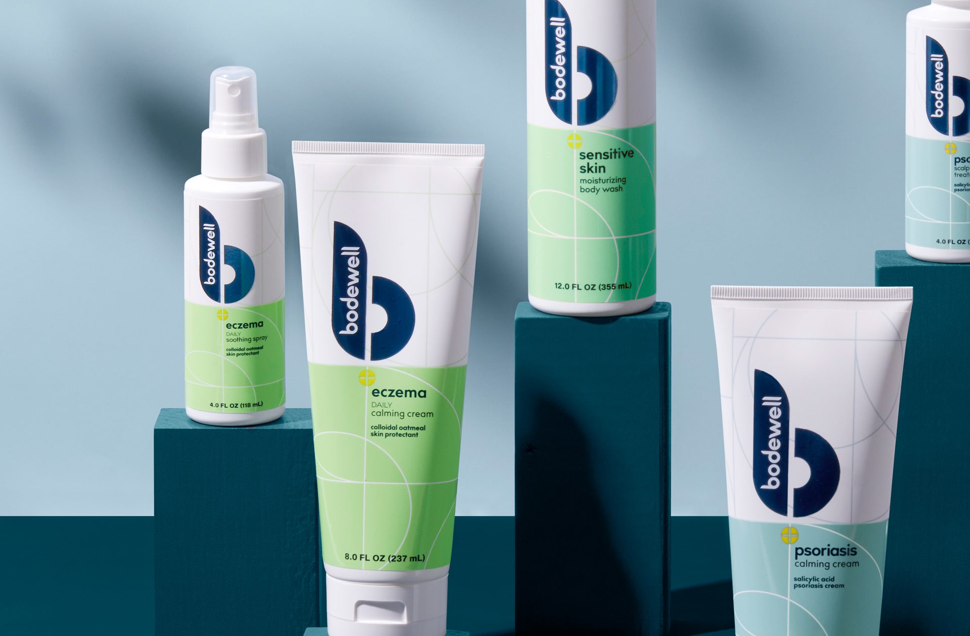 Photograph of a full product line of Bodewell haircare products after a rebrand, showcasing showcasing cleaner coloring, use of metallic foils and inks.