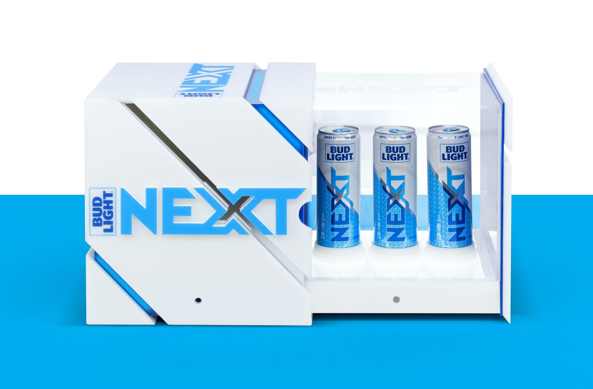 Photograph of a brand activation kit & influencer unboxing experience promoting the launch of BUD LIGHT NEXT, opening up to reveal three cans of bud light next.