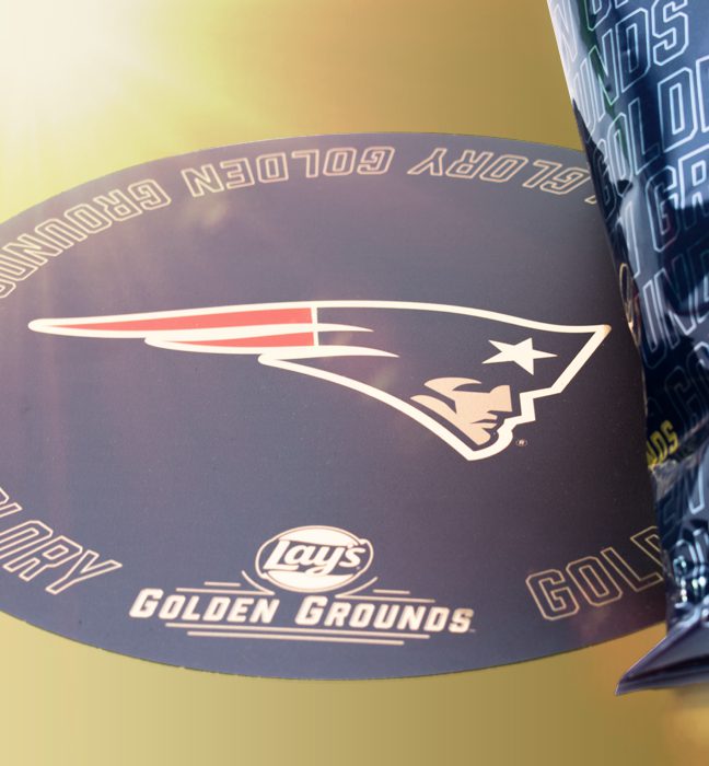 Close-up shot of an NFL team logo as part of an influencer unboxing experience for Lays Golden Ground.