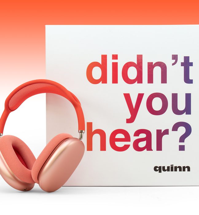 Photograph of the pink Quinn headphones leaning on an Influencer Unboxing Experience for the Quinn app.