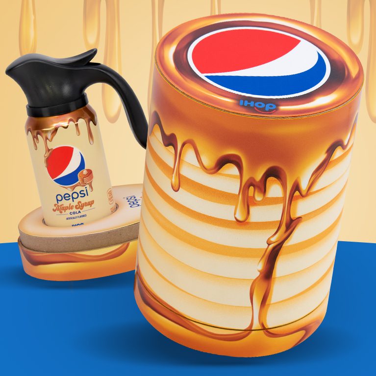 Photograph of an influencer unboxing experience promoting the limited edition IHOP x Pepsi maple syrup flavor, featuring a can of cola with a custom Pepsi Spout, inspired by the iconic IHOP syrup pitchers.