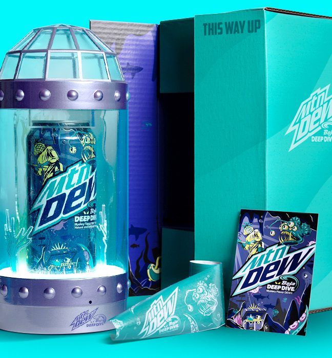 Close-up shot of an influencer unboxing experience for Mountain Dew's summer of baja, promoting Baja Deep Dive and including a custom card, mailer box and tape.