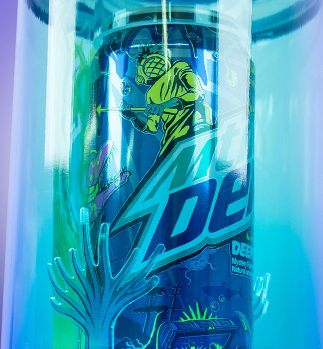 Close-up shot of an influencer unboxing experience for Mountain Dew's summer of baja, promoting Baja Deep Dive