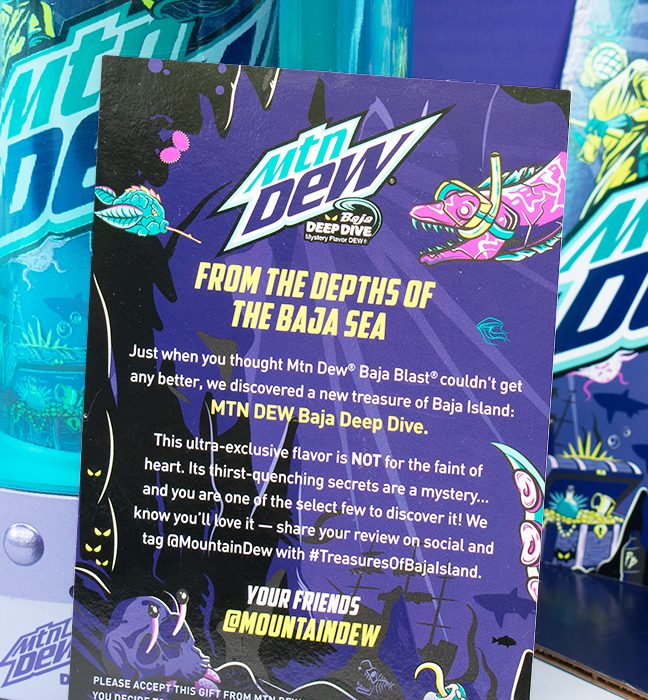 Close-up shot of the custom message cards inside an influencer unboxing experience for Mountain Dew's summer of baja, promoting Baja Deep Dive.