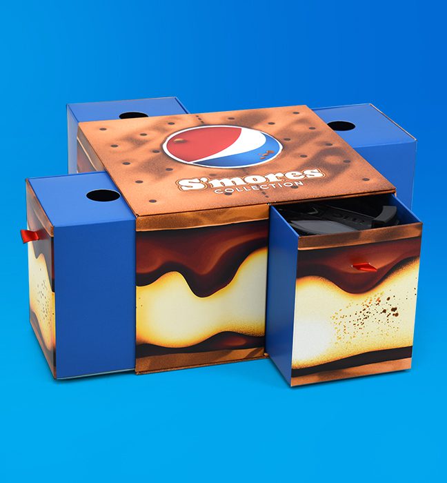 Close-up shot of an Influencer Unboxing Experience promoting the limited time Pepsi S’mores collection, opening up 4 drawer-like compartments.