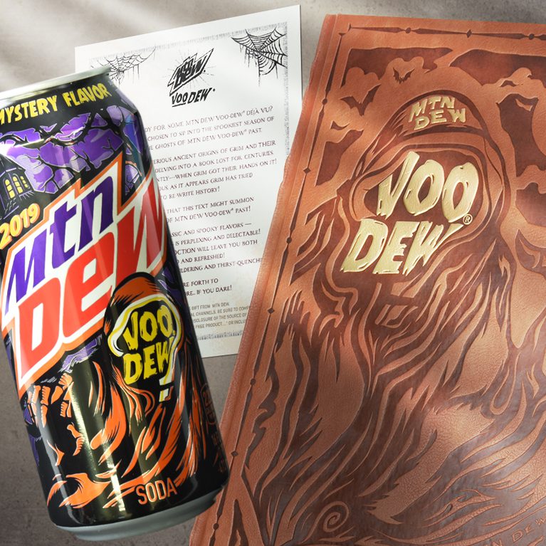 Photograph of a halloween themed influencer unboxing experience for Mountain Dew Voodew, featuring a can of limited edition mtn dew voodew flavor.