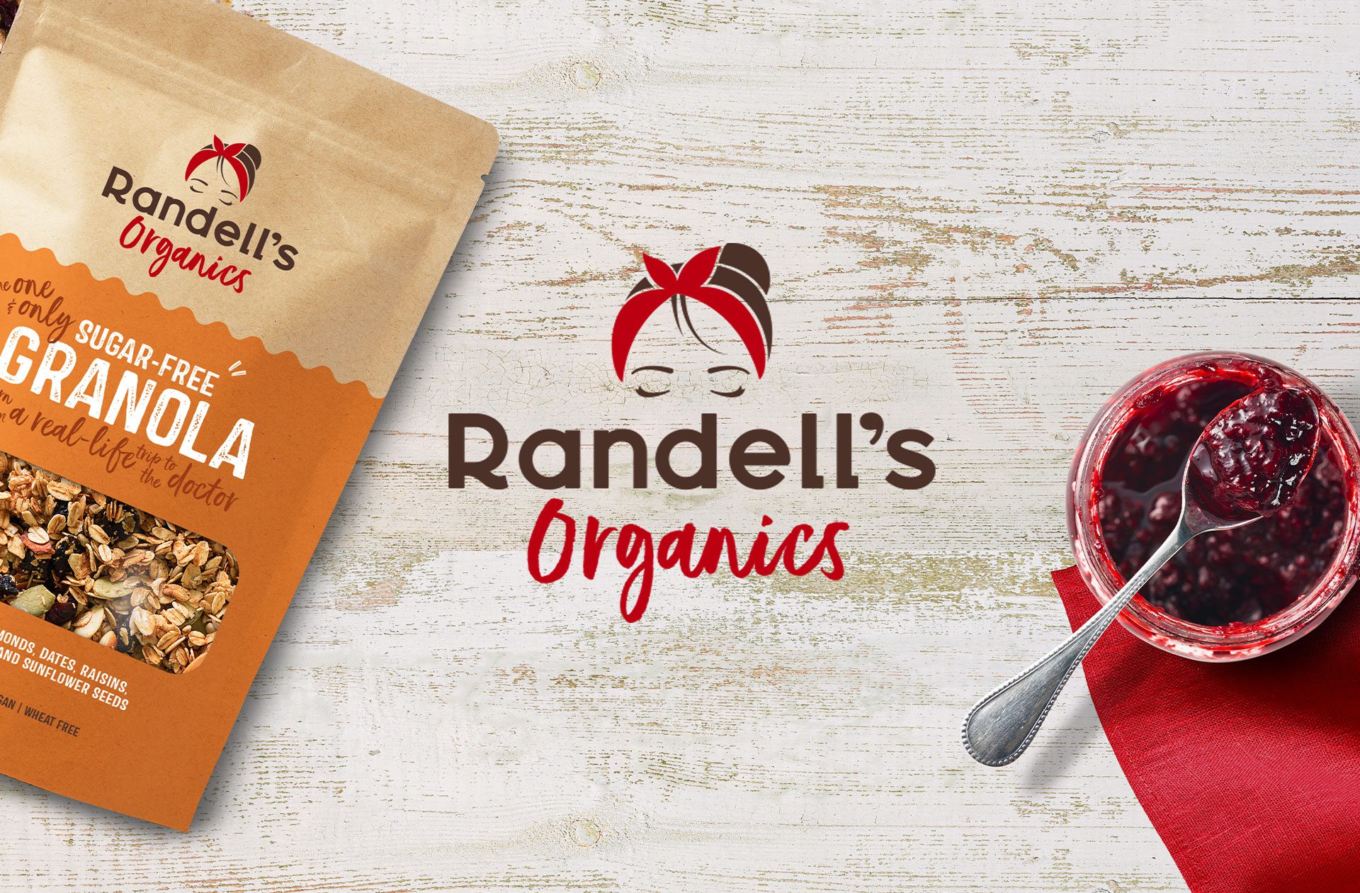 Render of promotional imagery for startup business Randell’s Organics, featuring packaging, a jar of jam and the brand's logo, showcasing cpg branding and logo design services.