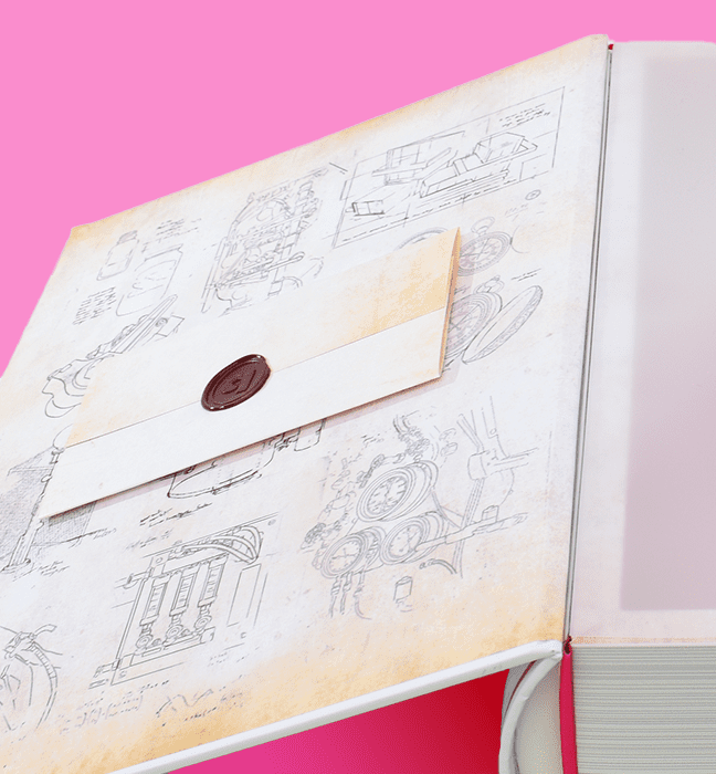 Close up shot of the details on an Influencer Unboxing Experience for The Inventor's Apprentice, a Quinn Original audiobook.