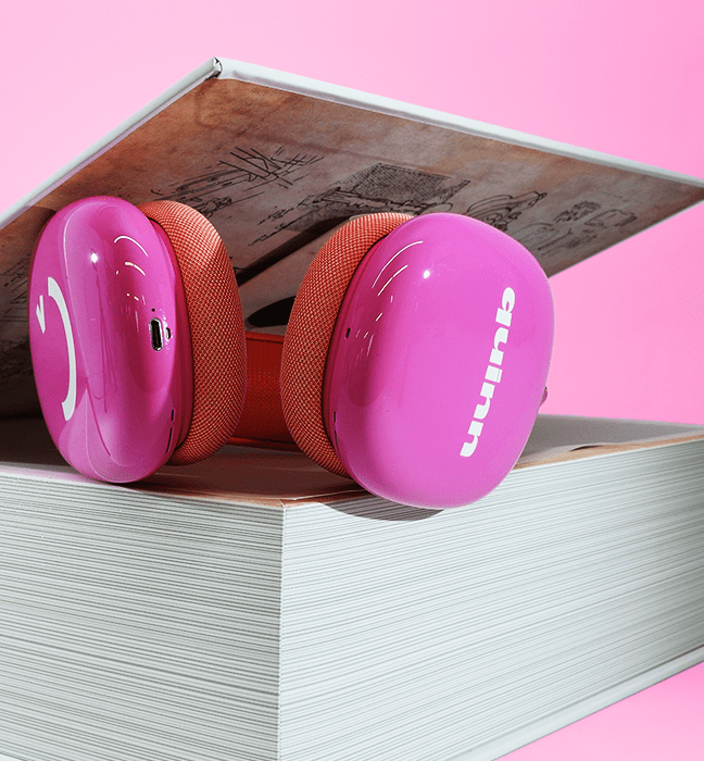 Close up shot of Quinn headphones inside an Influencer Unboxing Experience for The Inventor's Apprentice, a Quinn Original audiobook.