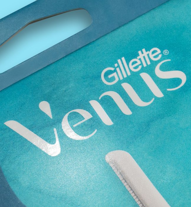 Close up photograph of the packaging gloss details on dermaplaning at home skincare range by Gillette Venus, showcasing packaging design services for consumer packaged goods.